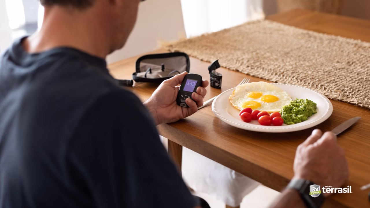 Man at table with healthy beakfast on plate